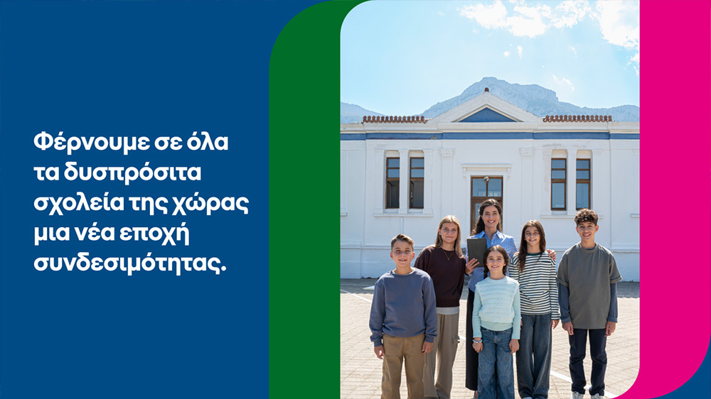 Group of students and teachers in front of a school building
